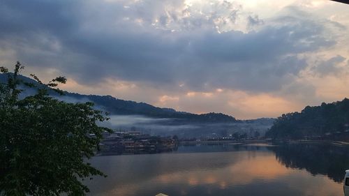 Scenic view of lake against sky during sunset