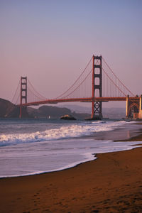 View of suspension bridge at sunset