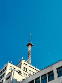 Low angle view of building against blue sky