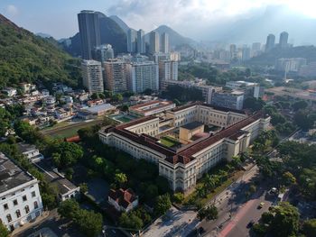 High angle view of buildings in city against sky