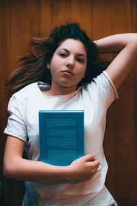 Portrait of young woman using mobile phone