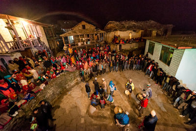 High angle view of people on street at night