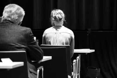 Rear view of people sitting in auditorium