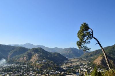 Scenic view of mountains against clear blue sky