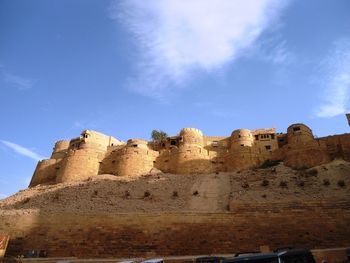 Low angle view of fort against sky