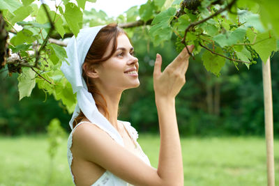 Side view of young woman looking away