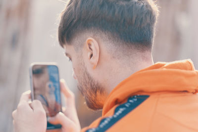 Portrait of man using phone