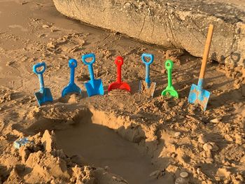 High angle view of toys on beach