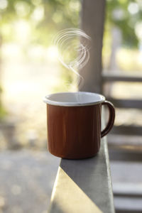 Close-up of coffee cup on table