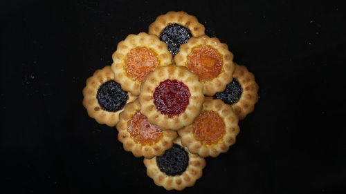 Close-up of raspberries against black background