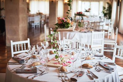 Flower vase on table in restaurant