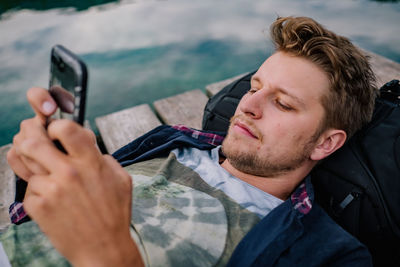 Young man using mobile phone 