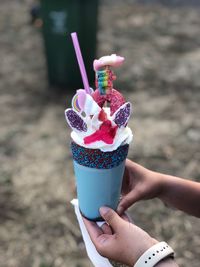 Cropped hands holding ice cream 