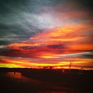 Scenic view of dramatic sky during sunset