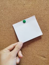 High angle view of person holding paper