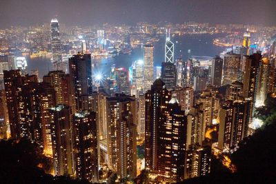 Aerial view of city lit up at night