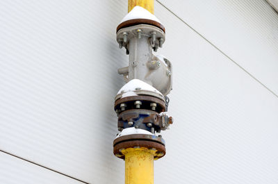 Low angle view of electric lamp against clear sky