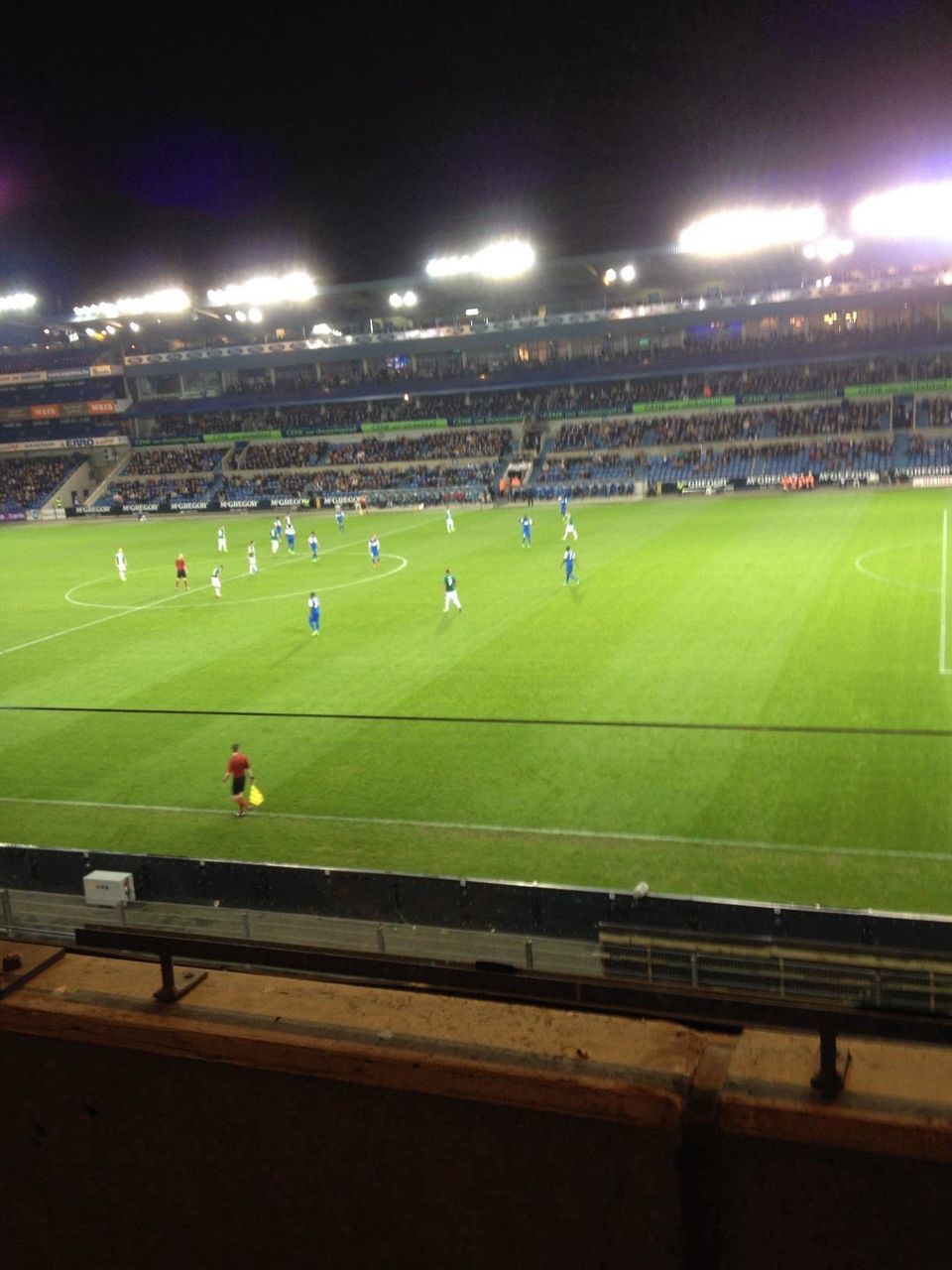 sport, green color, grass, night, field, large group of people, illuminated, playing field, leisure activity, building exterior, built structure, architecture, landscape, lifestyles, stadium, men, soccer, city, competition