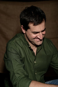 Close-up of man sitting outdoors