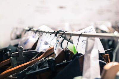 Close-up of clothes hanging on rack