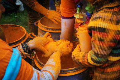 High angle view of people working on barbecue grill