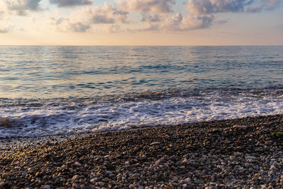 Calm sea and pebble beach. the most common photograph of the sea