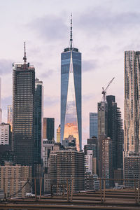 Low angle view of one world trade center against sky in city
