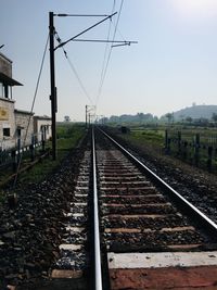 Railroad tracks against clear sky