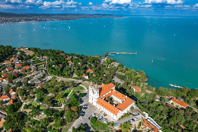 High angle view of townscape by sea