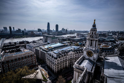 High angle view of buildings against sky in city during sunny day