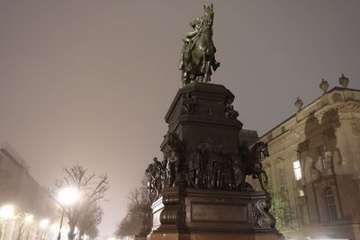 Low angle view of statue against sky