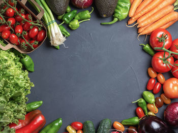 Fresh vegetables with circle in the center for copy space dark w