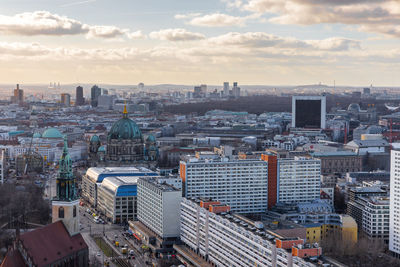 High angle view of city buildings against sky