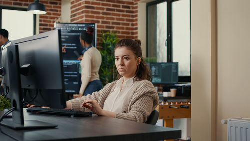 Young woman using laptop at home