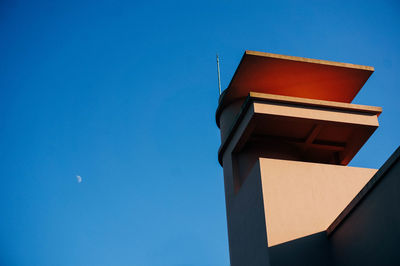 Low angle view of building against blue sky