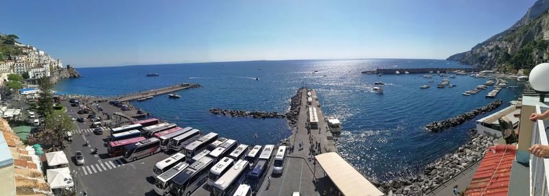 High angle view of boats in sea against blue sky