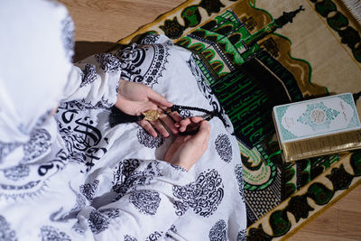 High angle of a muslim woman praying during ramadan