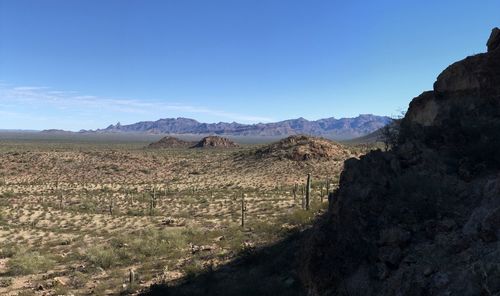 Scenic view of mountains against clear blue sky