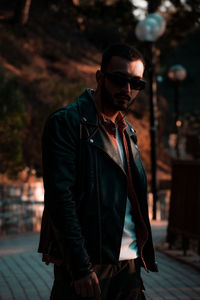 Young man wearing sunglasses standing outdoors