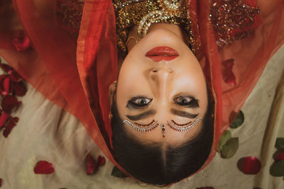 Close up of indian woman with traditional dress upside down