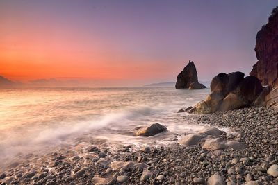 Scenic view of sea at sunset