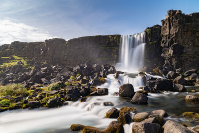 Scenic view of waterfall - Öxarárfoss