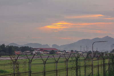 Scenic view of field against sky during sunset