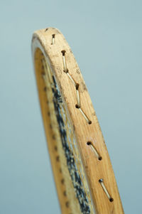 Close-up side view of tennis racquet against clear sky