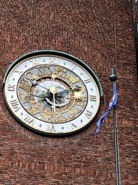 Low angle view of clock on wall