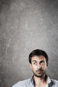 Portrait of man against gray background