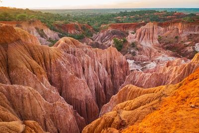 Tourists at the rock formations at marafa depression - hell's kitchen in malindi, kilifi, kenya