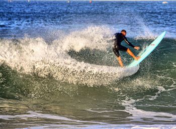 People surfing in sea