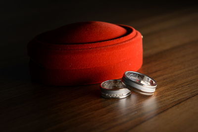 Close-up of wedding rings on table