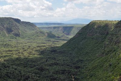 Scenic volcanic crater against a mountain background, mount suswa, rift valley, kenya